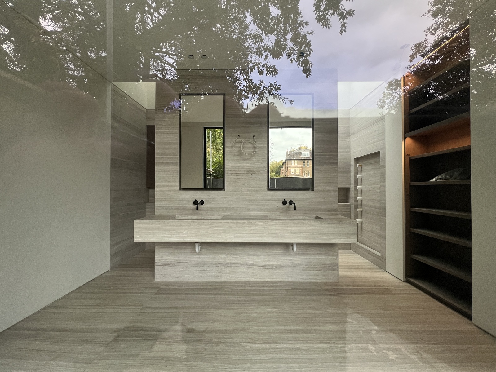 Finished Hampstead ensuite vanity through glass