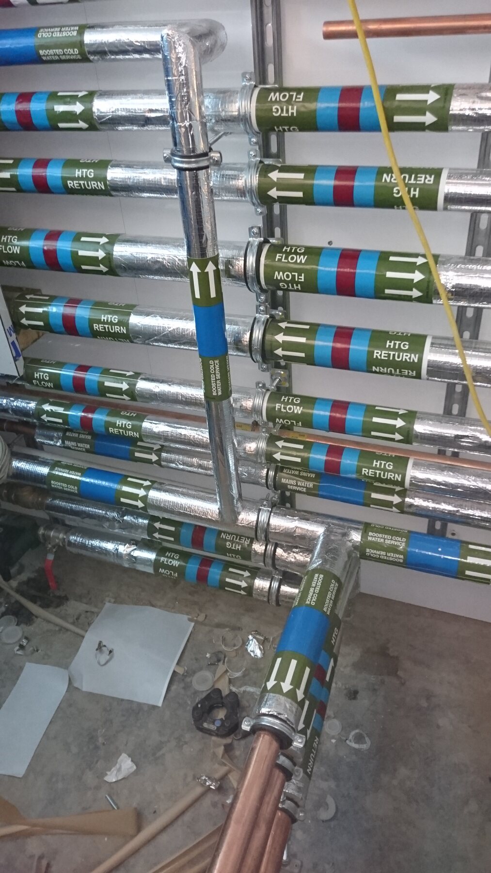 Insulated heating flow, return and water-service pipework at Selwyn House